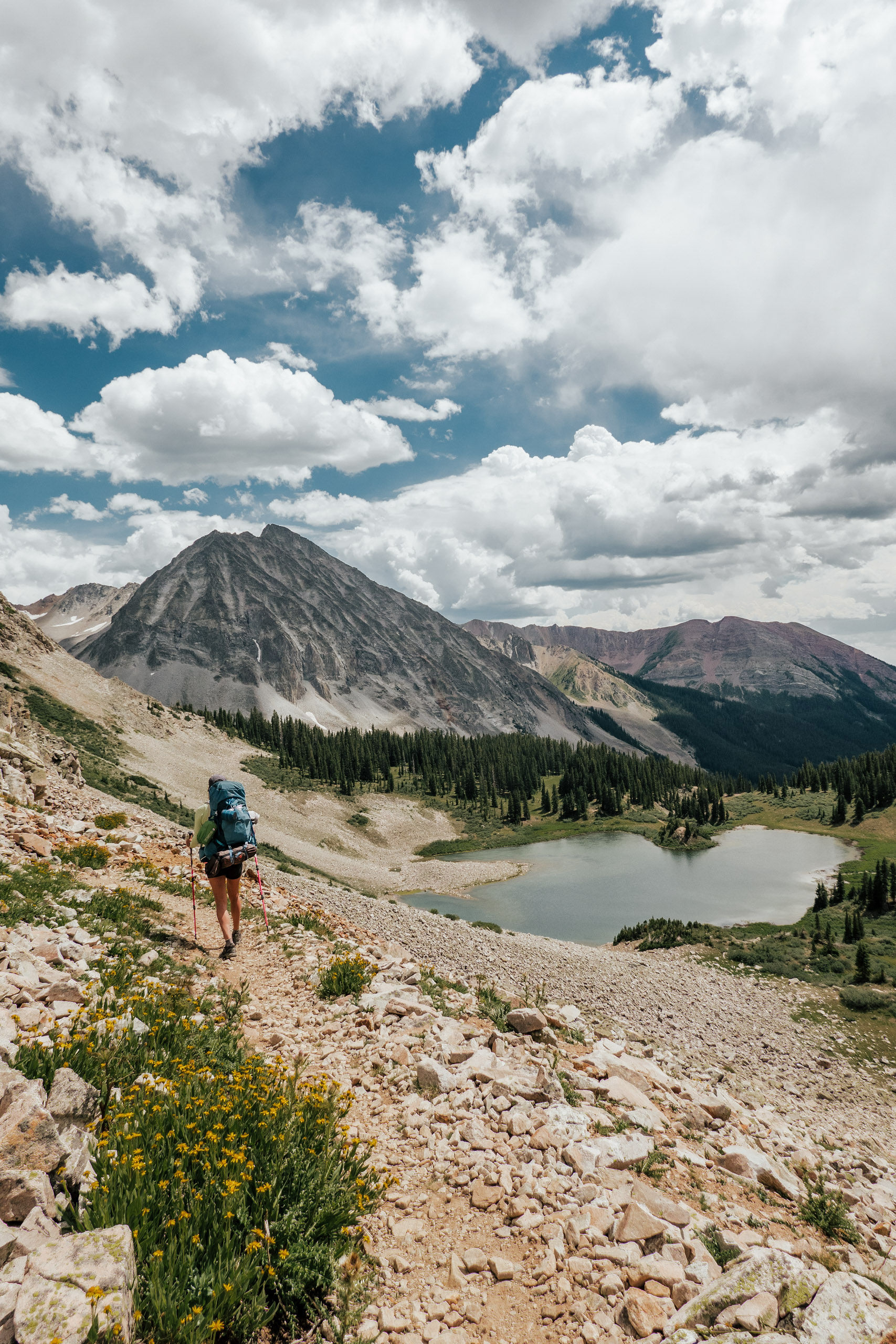a woman backpacking the east maroon creek trail from Aspen to Crested Butte
