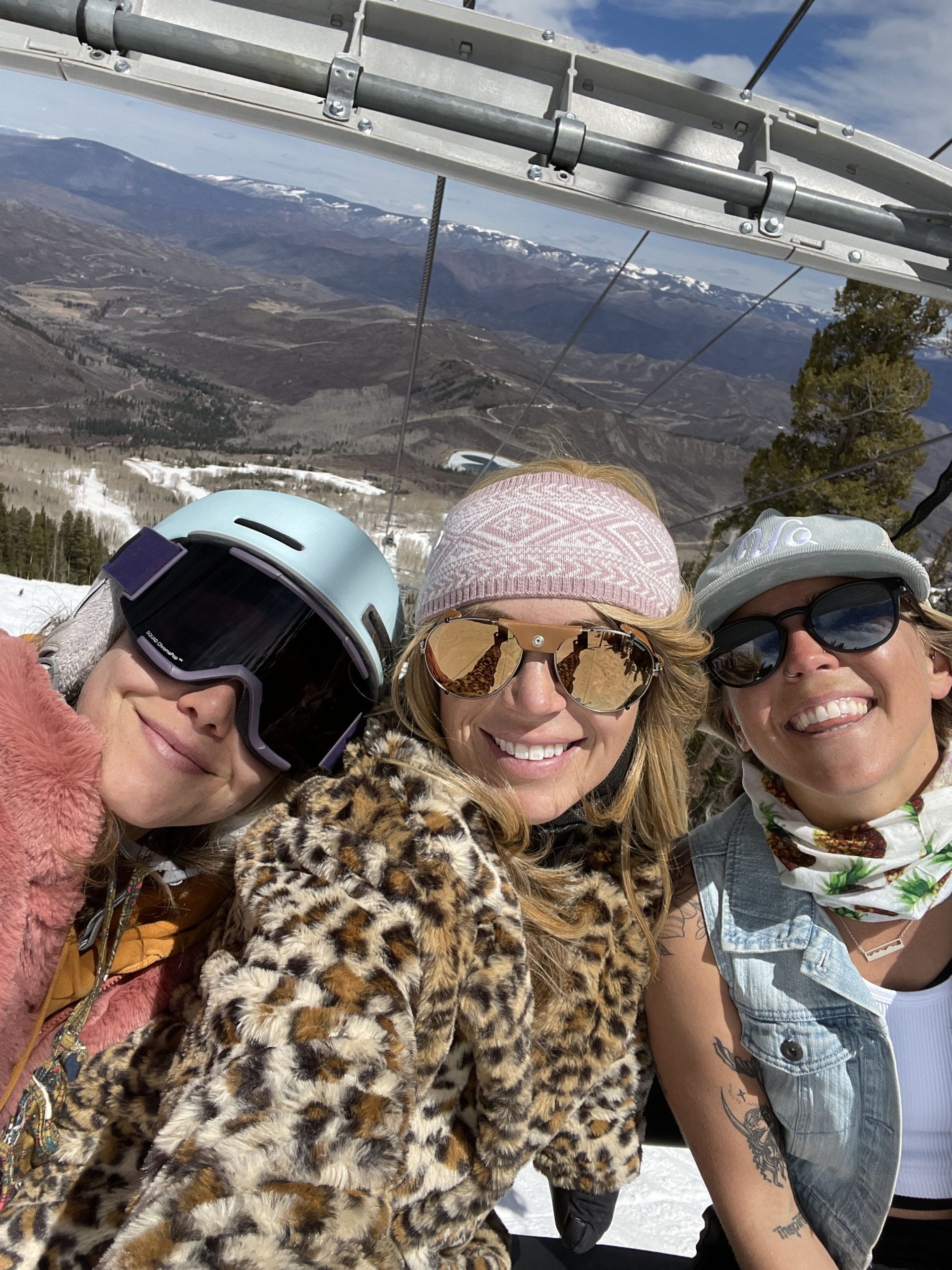 selfie of girlfriends on a ski lift chair together